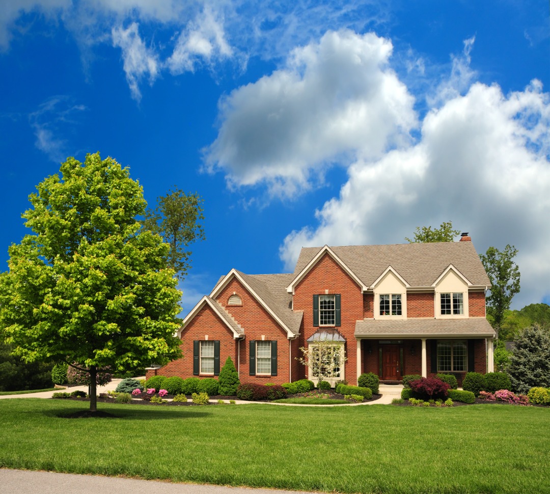 A beautiful home with a lush lawn.