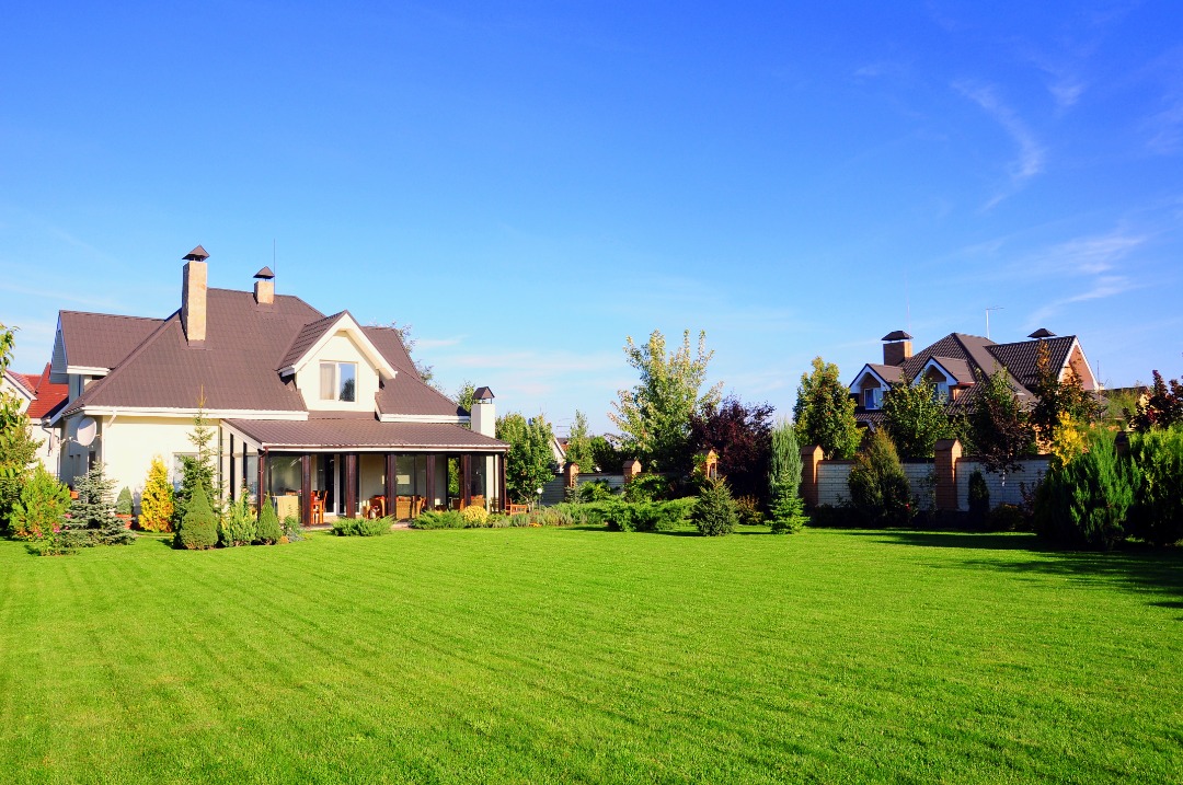 A professionally managed landscape with lush green grass.
